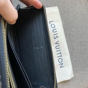 Long zippy black leather wallet